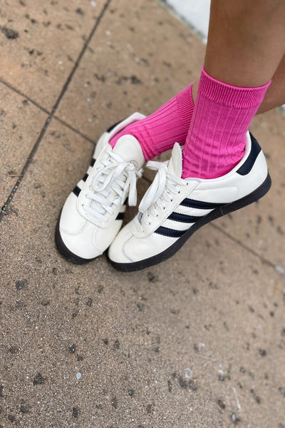 Her Socks in Bright Pink